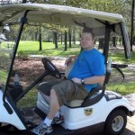 Roger driving the golf cart